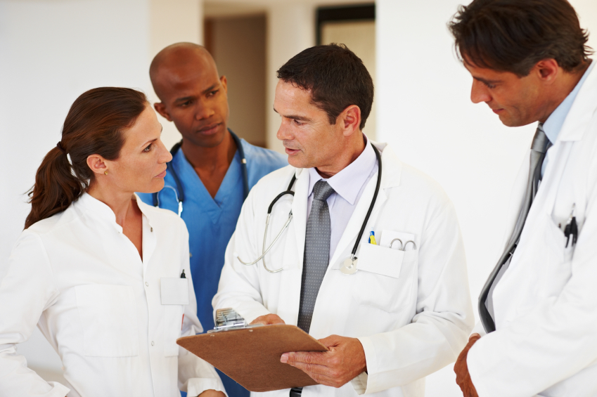 A group of doctors reviewing a case.